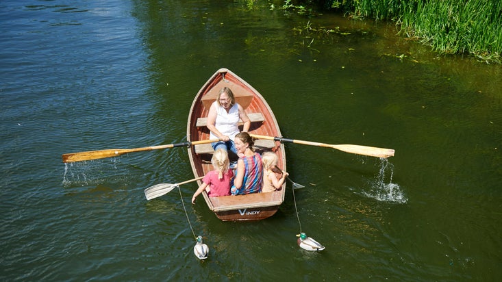 A family in a rowing boat on the River Stour at Flatford, Suffolk
